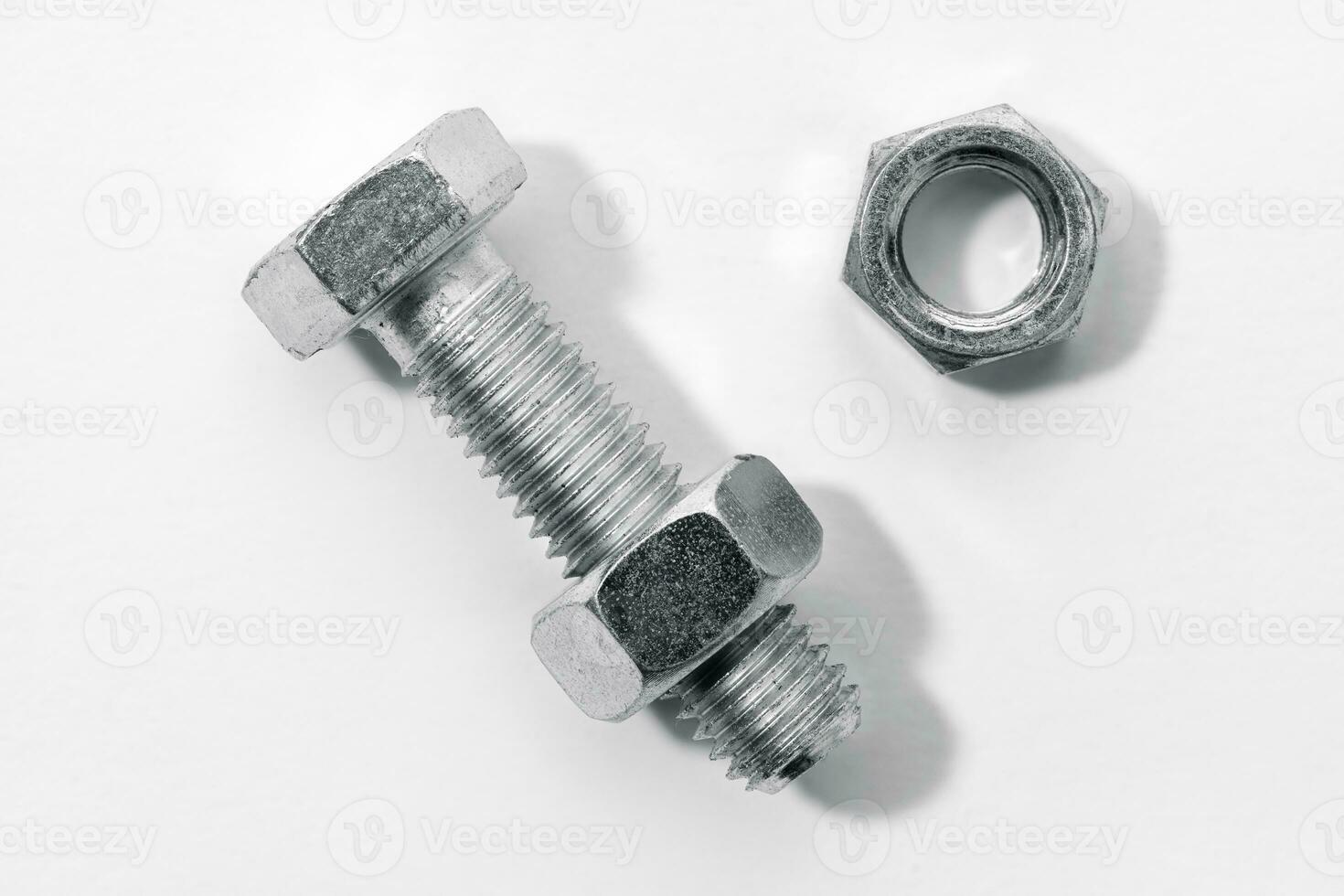 Bolt and nut isolated on white background photo