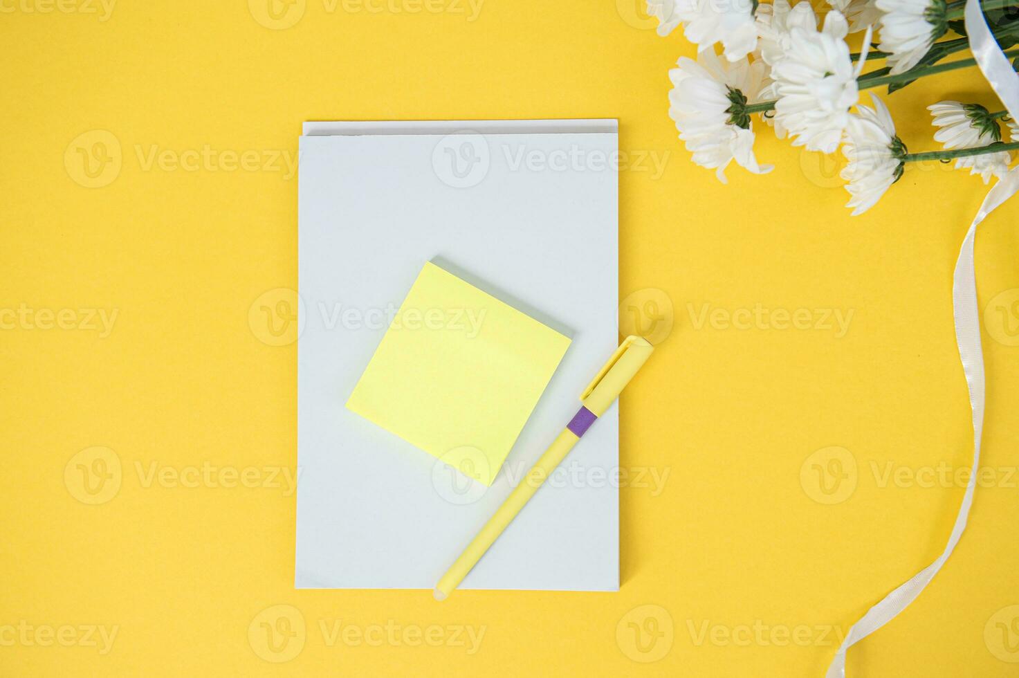 At the top, a close-up layout of stickers and a notebook of a clean open notebook with a copy space photo