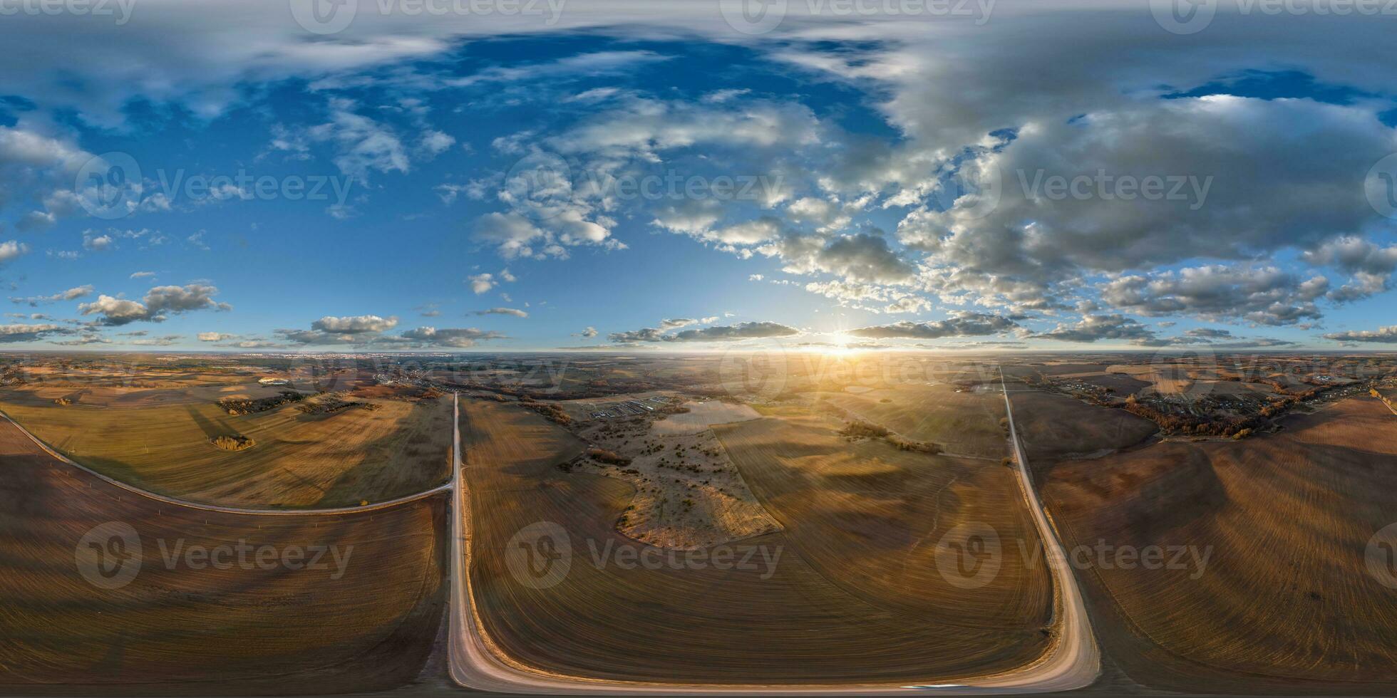 aerial full seamless spherical hdri 360 panorama view from great height above fields in countryside in equirectangular projection.  use like sky replacement for drone shots photo