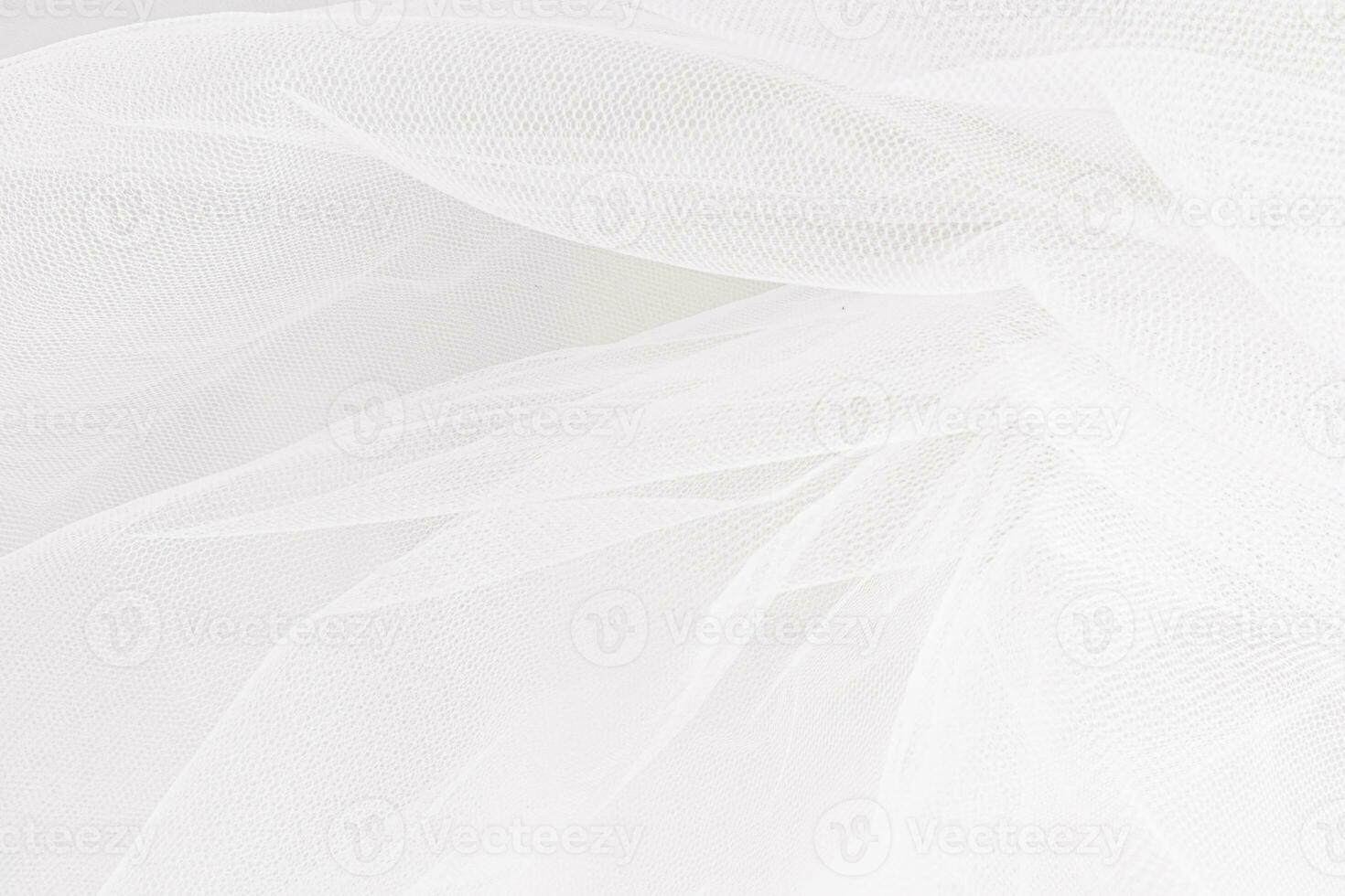 Delicate texture of the background. Elegant soft tulle fabric. Bridal wedding foil close-up for design, plase for text. photo
