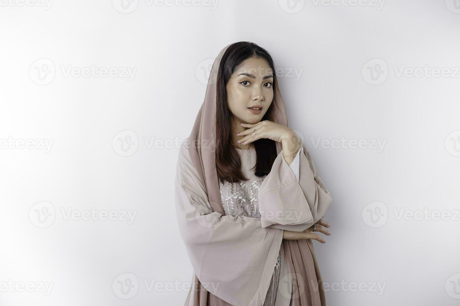 Portrait of a young beautiful Asian Muslim woman wearing a headscarf, beauty shoot concept photo