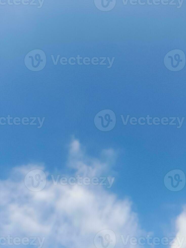 Beautiful white clouds on deep blue sky background. Large bright soft fluffy clouds are cover the entire blue sky. photo