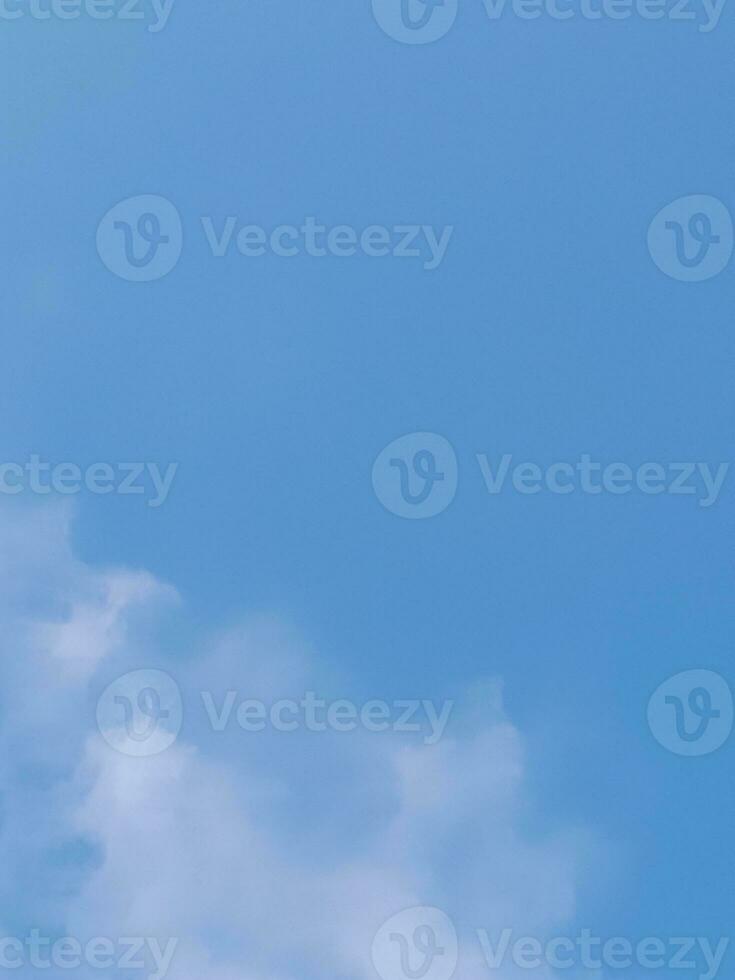 Beautiful white clouds on deep blue sky background. Large bright soft fluffy clouds are cover the entire blue sky. photo