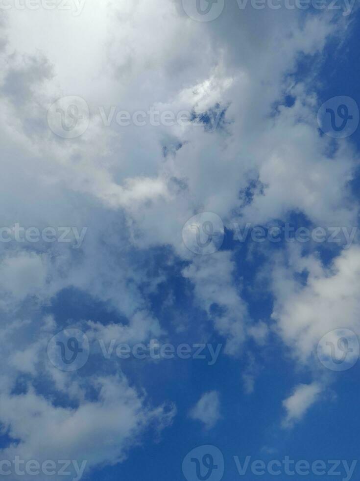 Beautiful grey clouds on sky background. Large bright soft fluffy clouds are cover the entire blue sky. photo