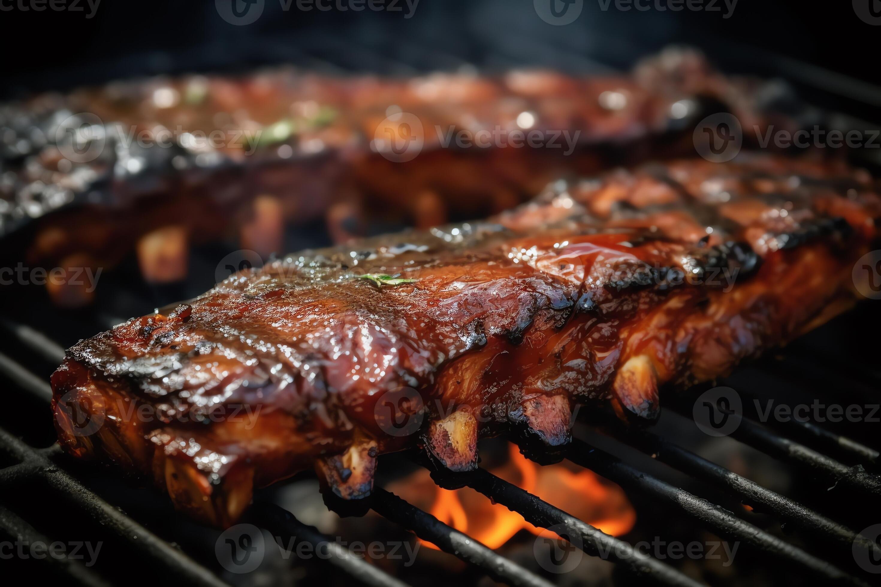 Bbq ribs grilled ribs on grill grate with fire closeup view summer