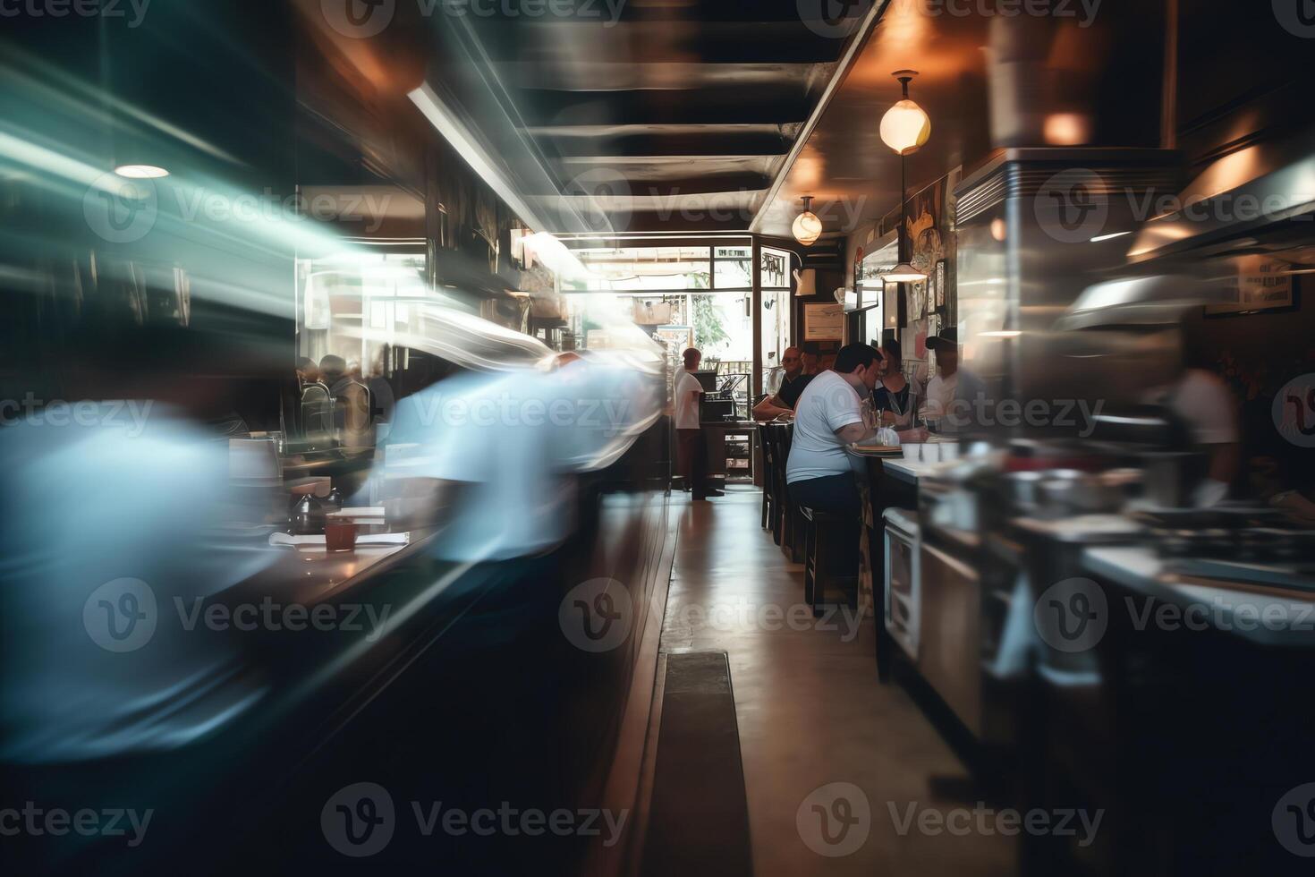 Blurred restaurant background with some people eating and chefs and waiters working. photo