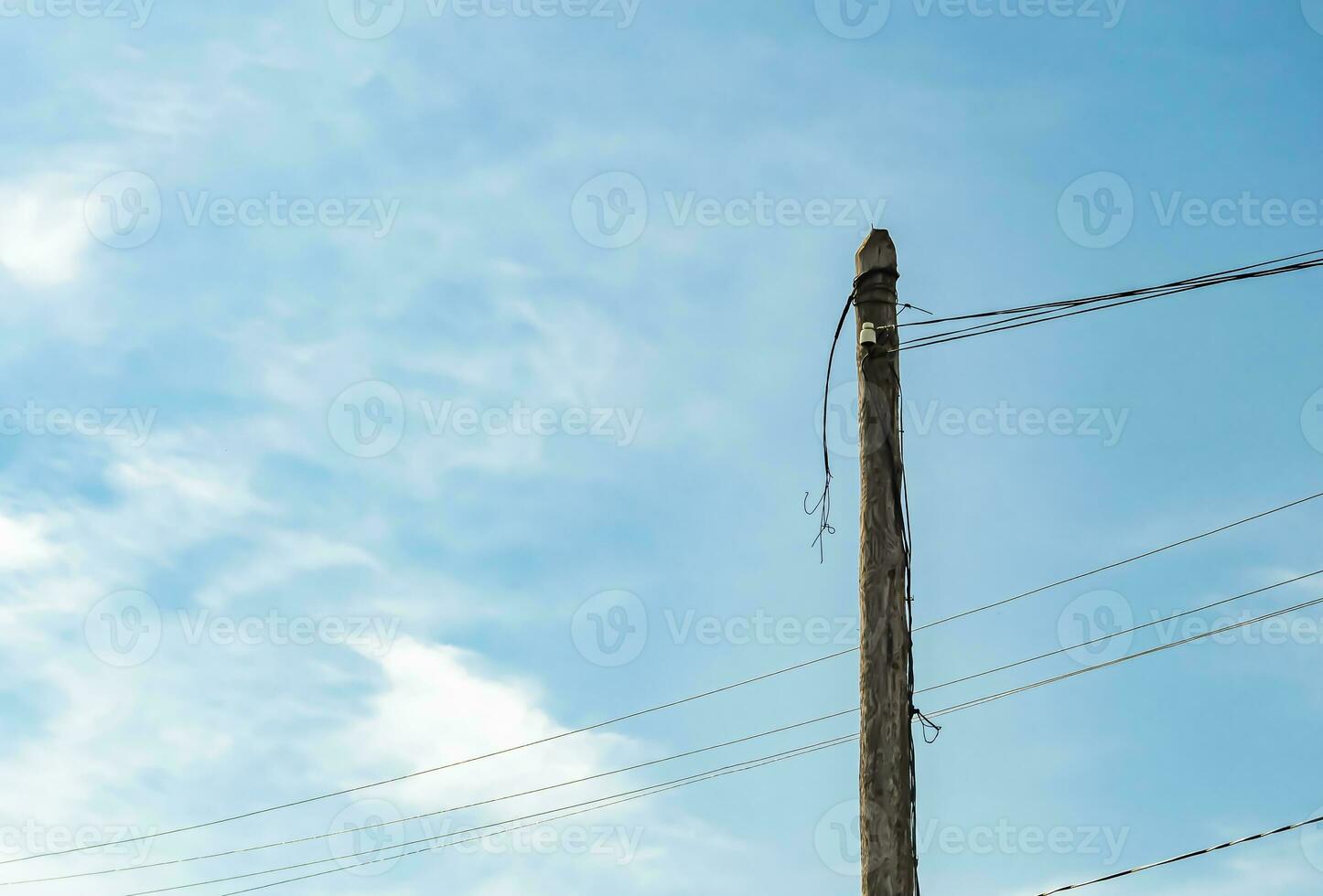 Power electric pole with line wire on colored background close up photo
