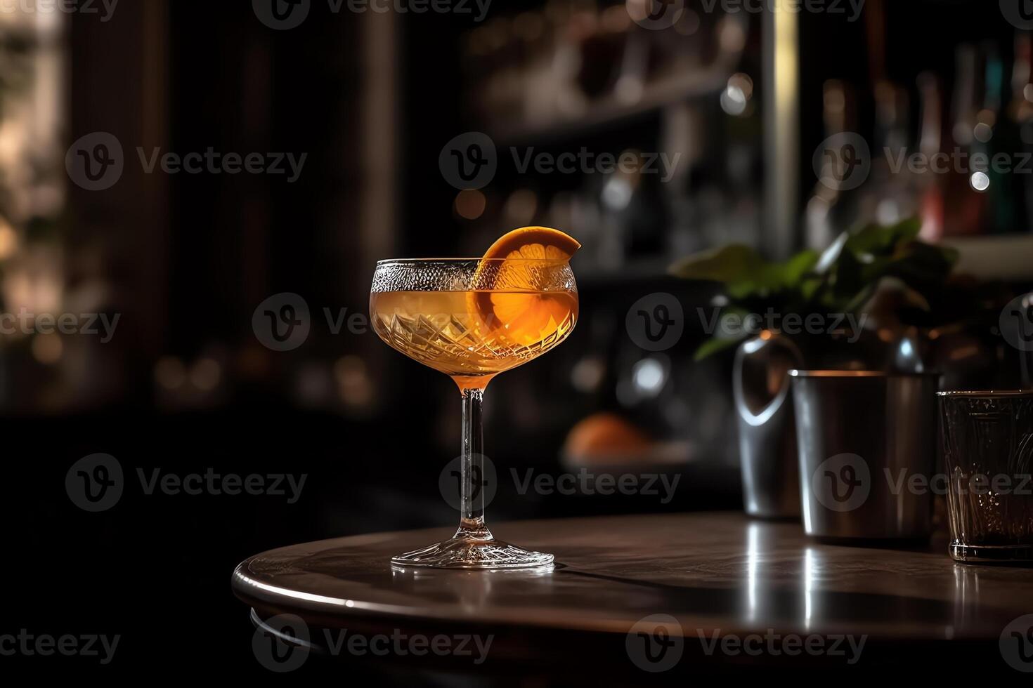 A cocktail glass with an orange slice on top cocktail on a bar counter. photo