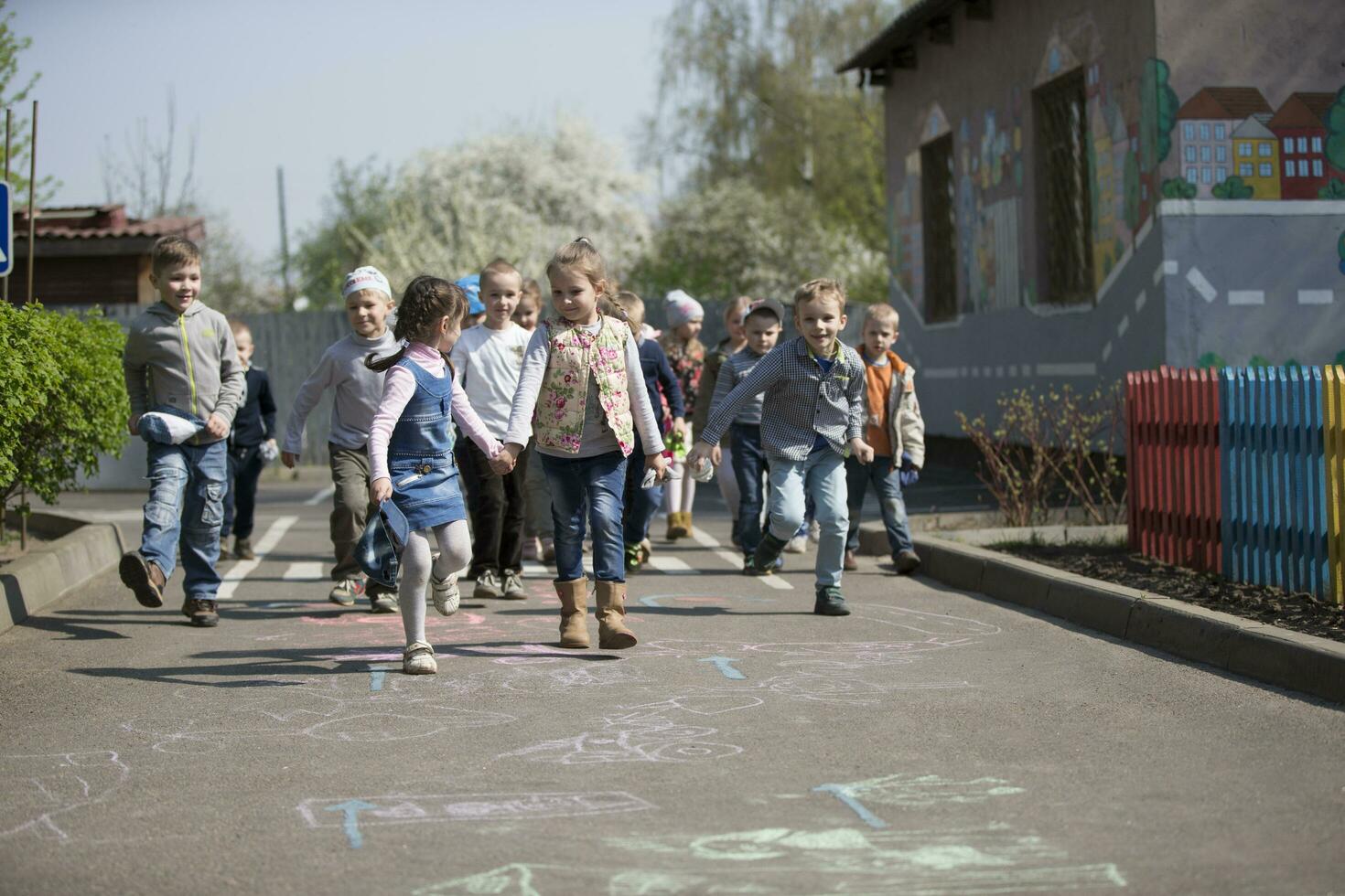 A group of children from kindergarten on a walk. photo