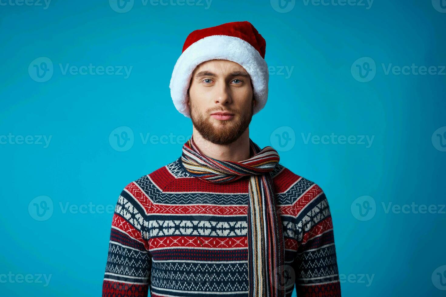 handsome man new year clothes christmas holiday blue background photo