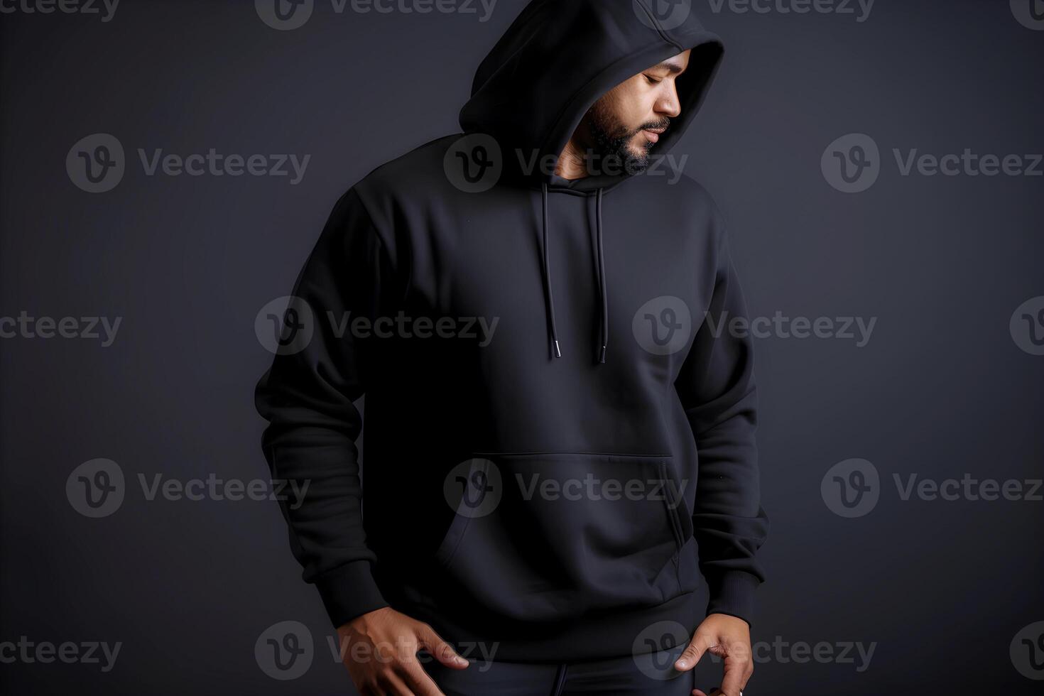 content, Urban portrait of a handsome hipster with a beard in a black blank hoodie with space for your logo or design. photo
