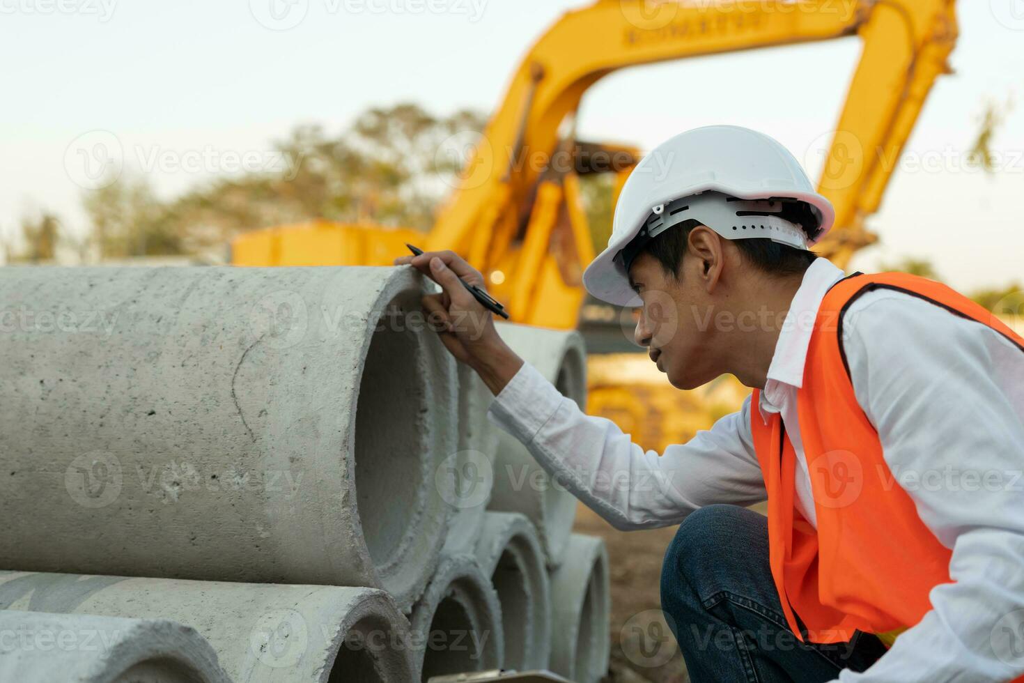 inspector or engineer is inspecting construction house using a checklist. Engineers and architects or contactor count materials for construction. Building, check, insurance house, quality, foreman. photo