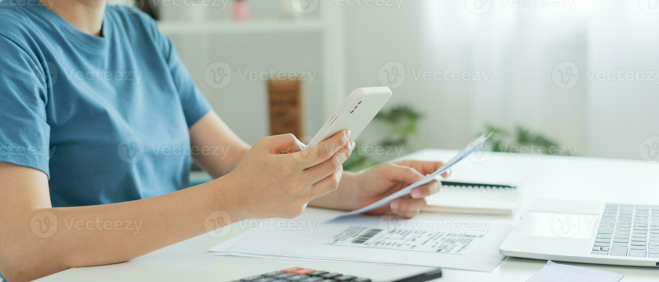 woman use phone scan barcode or QR codes to pay credit card bill after