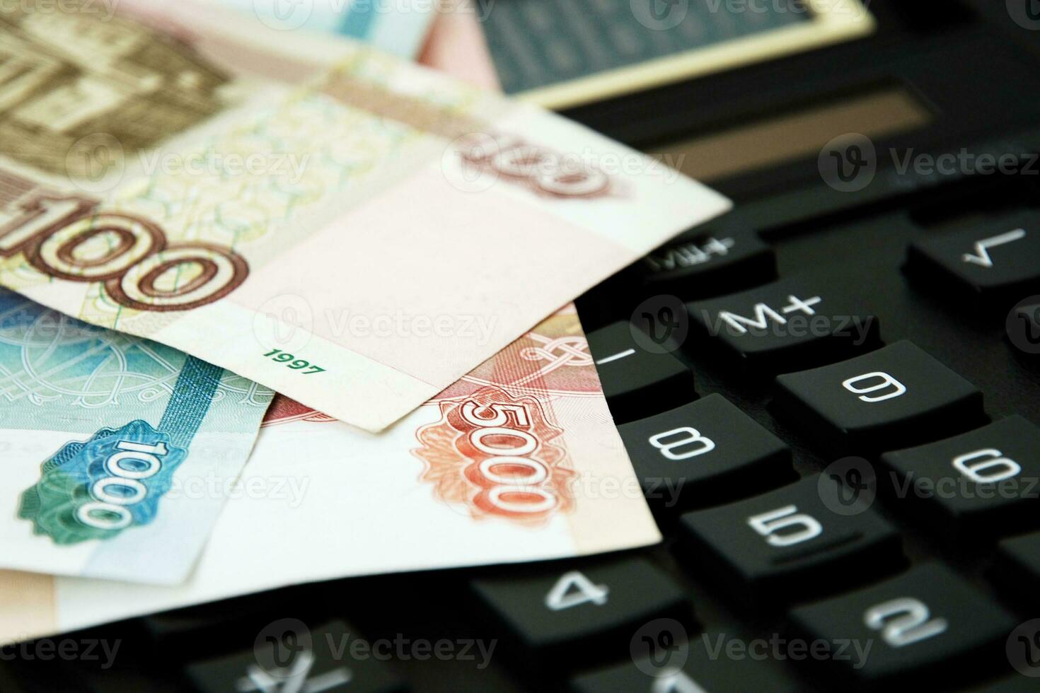 ruble banknotes on calculator keyboard, finance, accounting, crisis and savings concept photo
