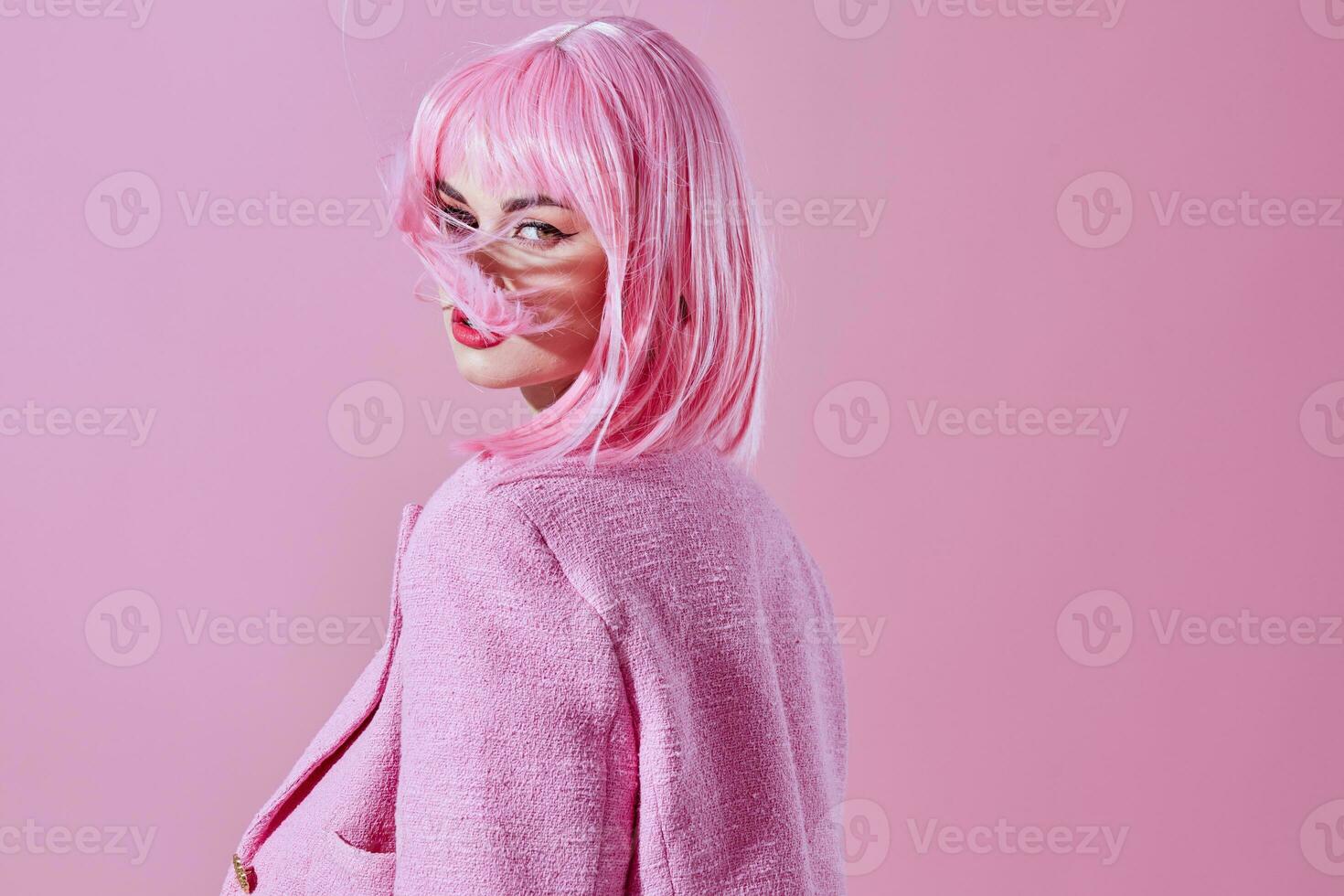glamorous woman with pink wig posing luxury photo
