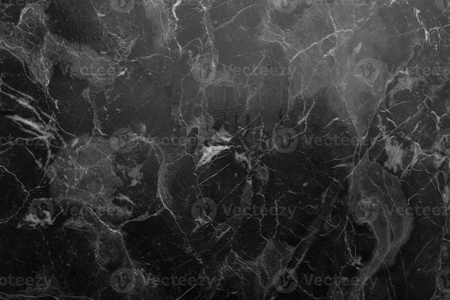 Gray marble background with light inclusions. Dark coating with light