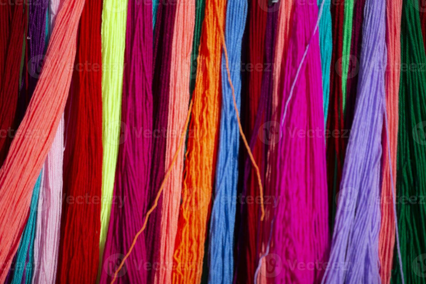 Multicolored background made of many colored threads. photo