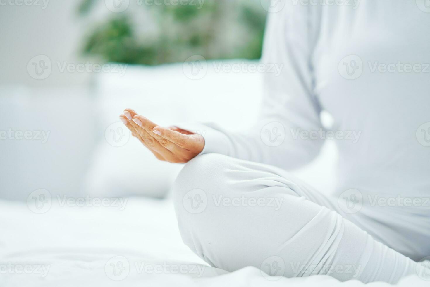 Nice female in bed relaxing or doing yoga photo