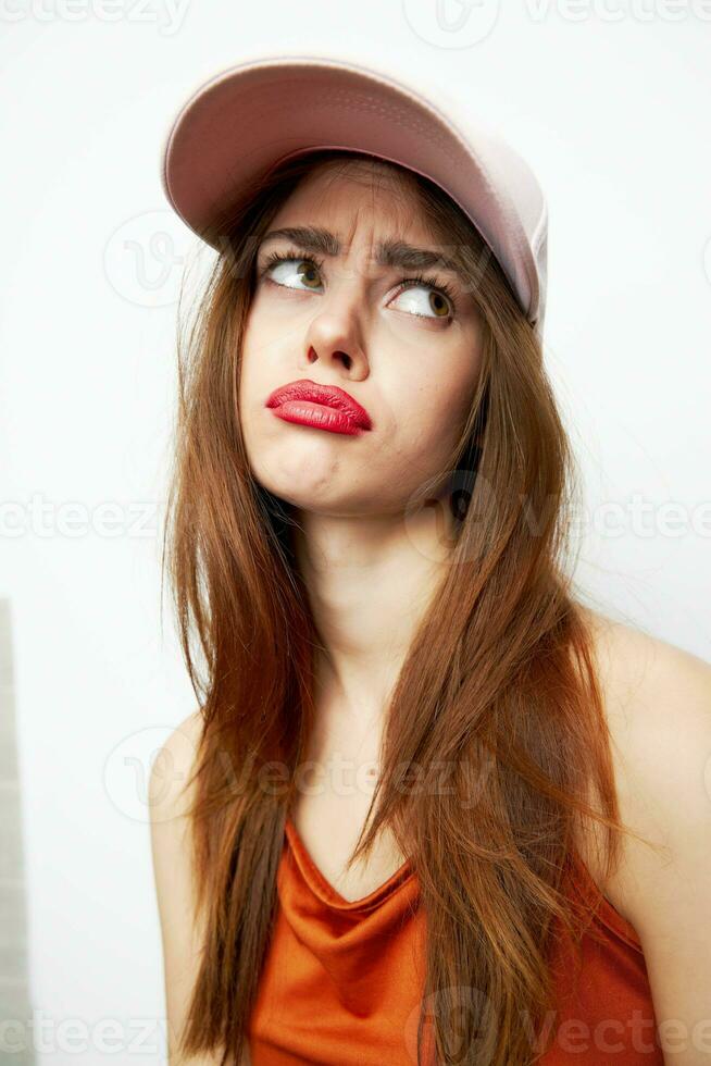 Woman with a cap A sad look to the side on her head fashionable clothes photo