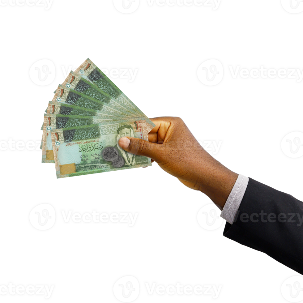 Black hand with suit holding New Jordanian Dinar notes isolated on transparent background, 3d rendering png