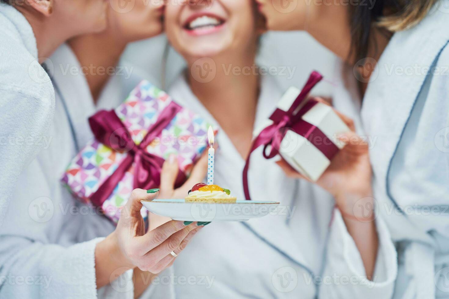 Picture of four girls in bathrobe having spa birthday party photo