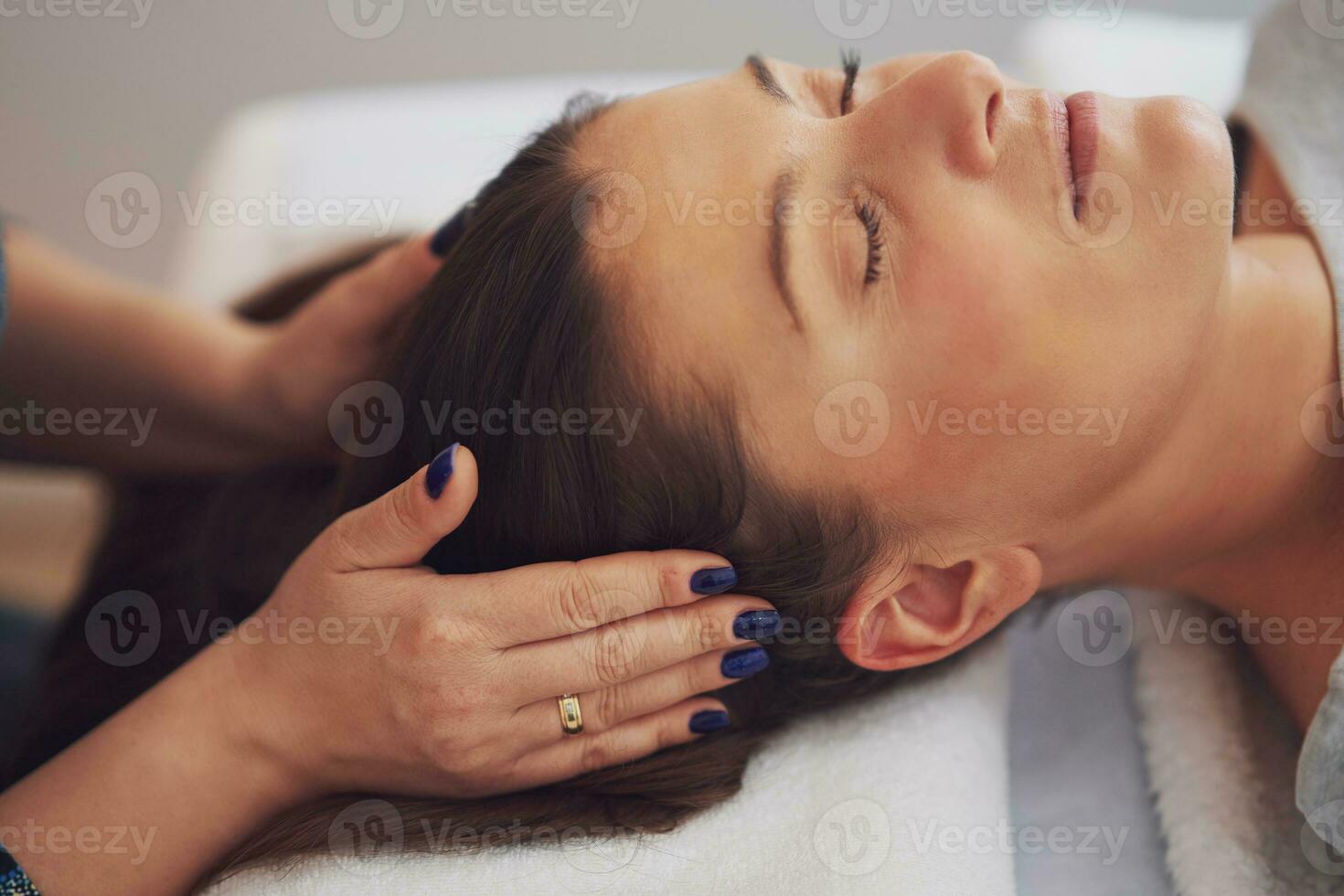 Picture of an treatment that involves gently touching 32 points on your head photo