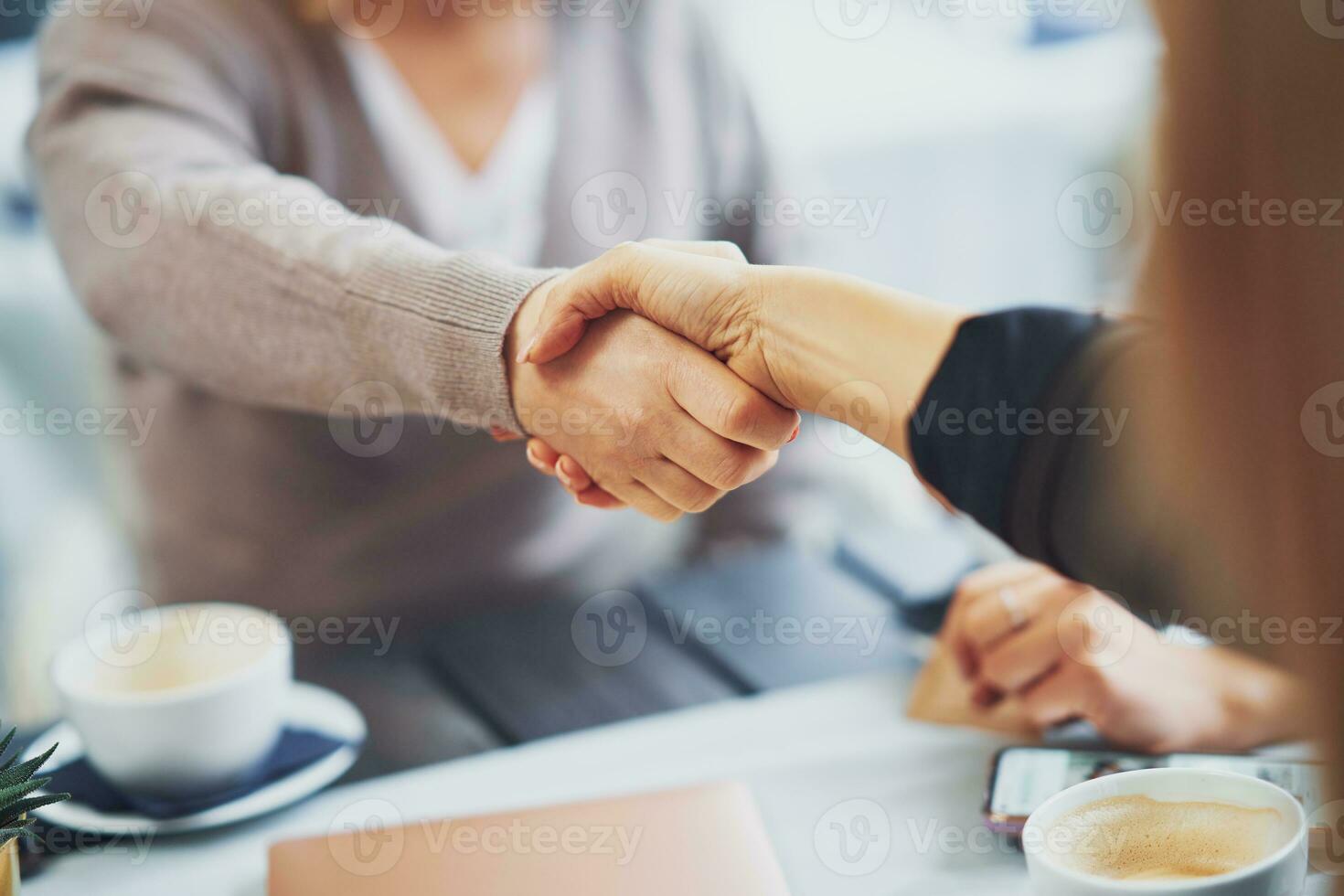 Close up of female hands on business meeting photo