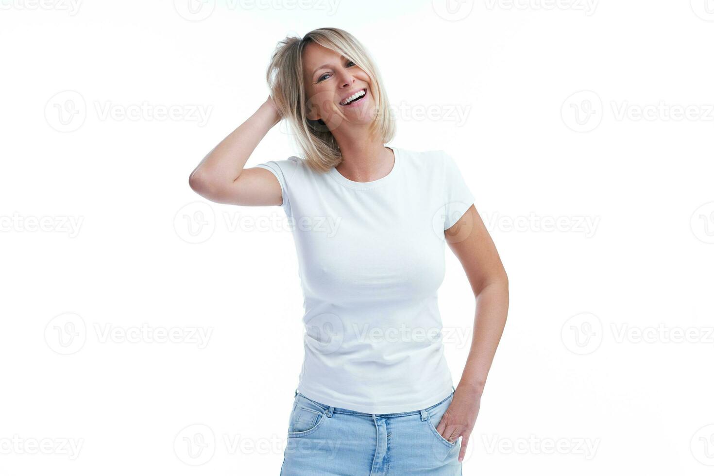 Picture of blonde woman over back isolated background making happy faces photo