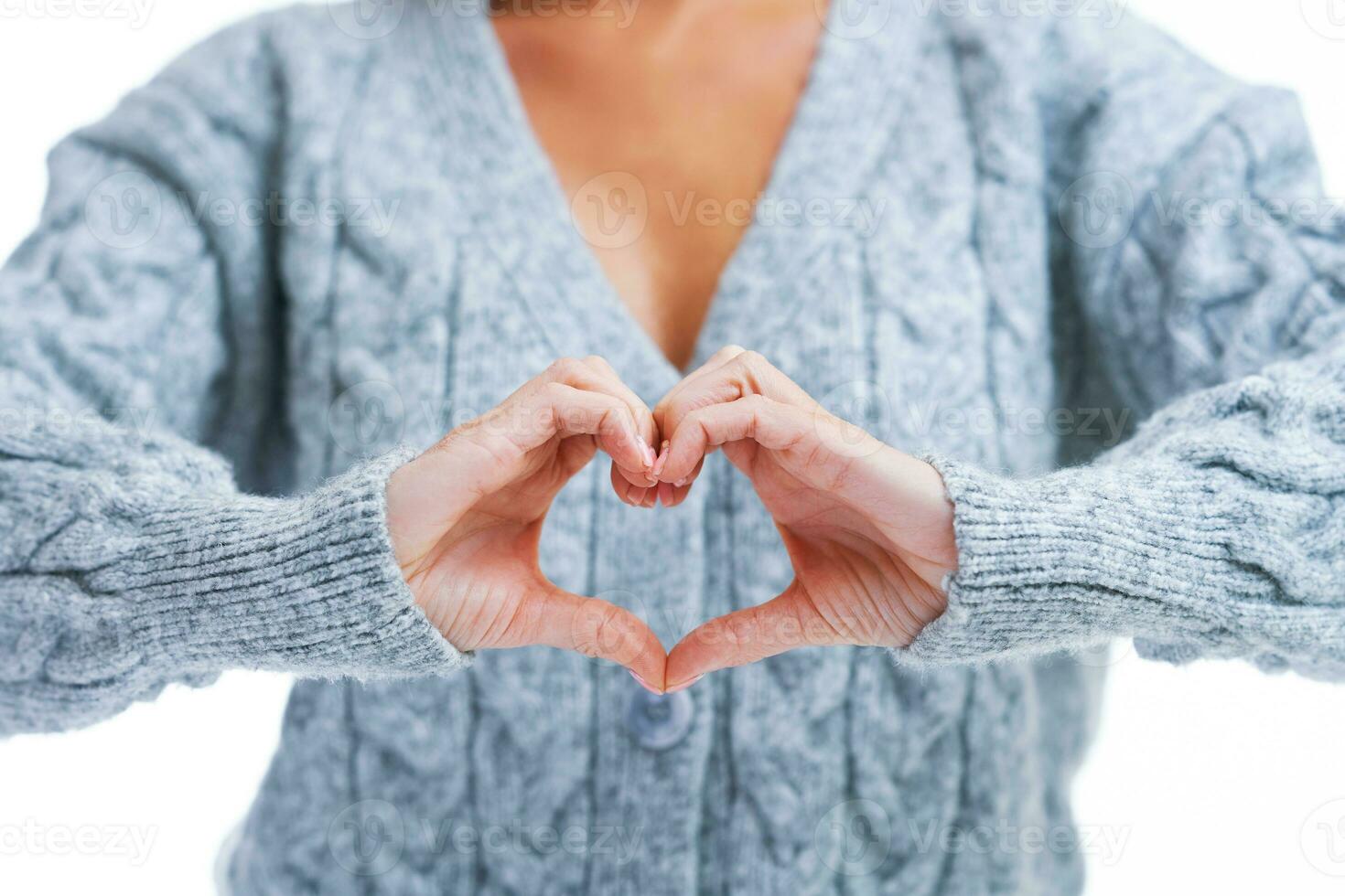 Picture of blonde woman over back isolated background showing heart photo