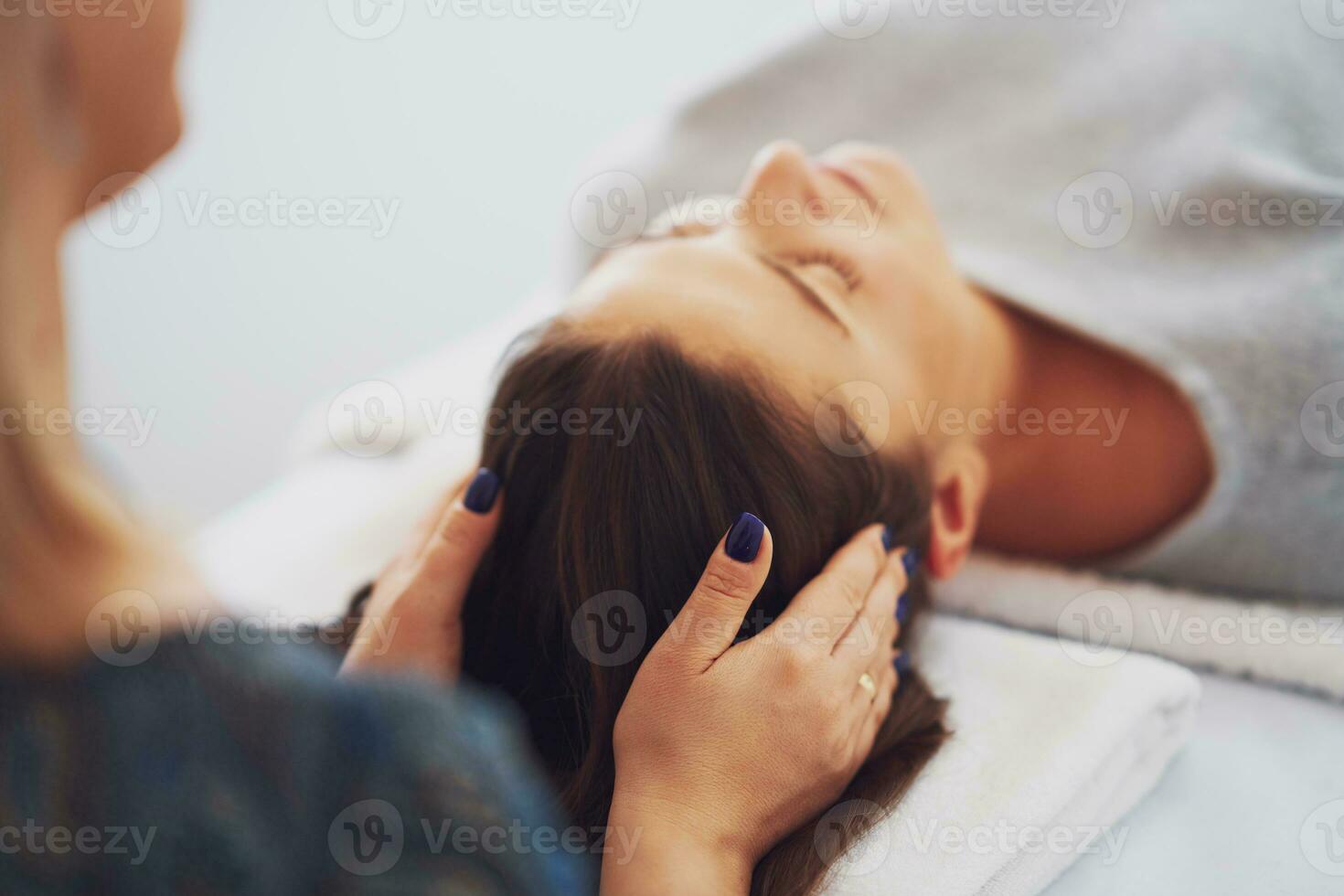 Picture of an treatment that involves gently touching 32 points on your head photo