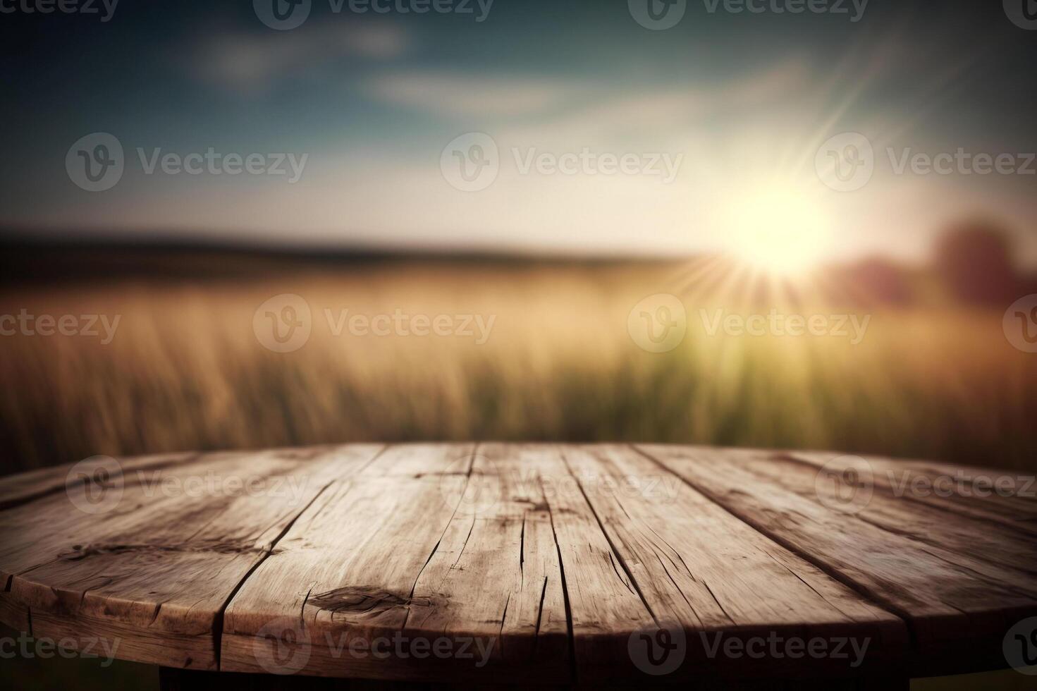 Empty wooden round table for product display with blurred field background. photo