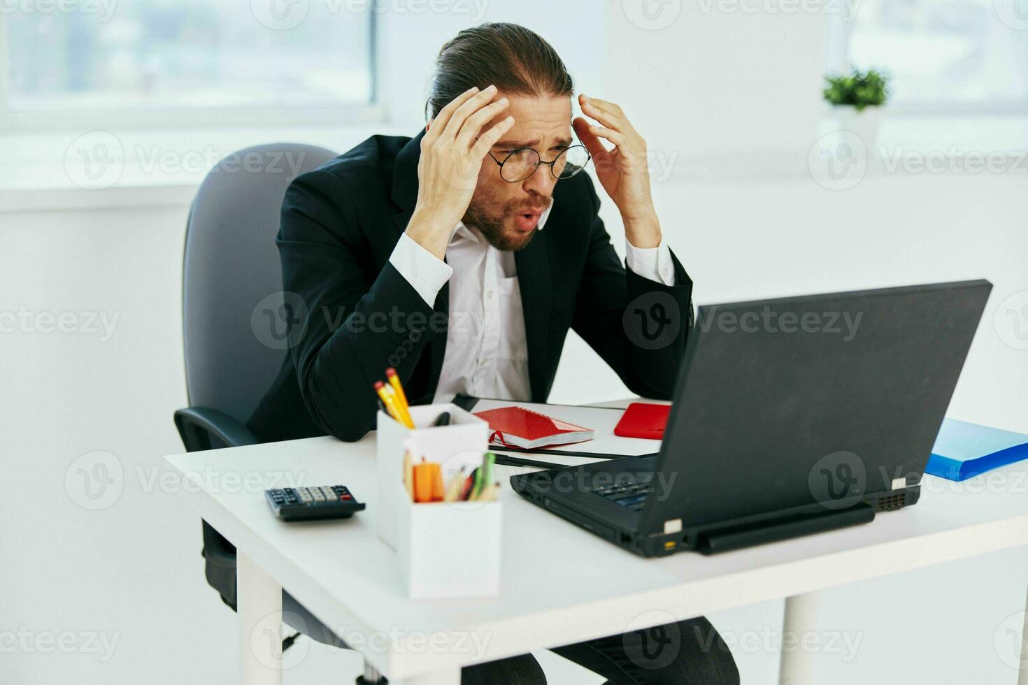 man in a suit work in the office in front of a laptop technologies photo