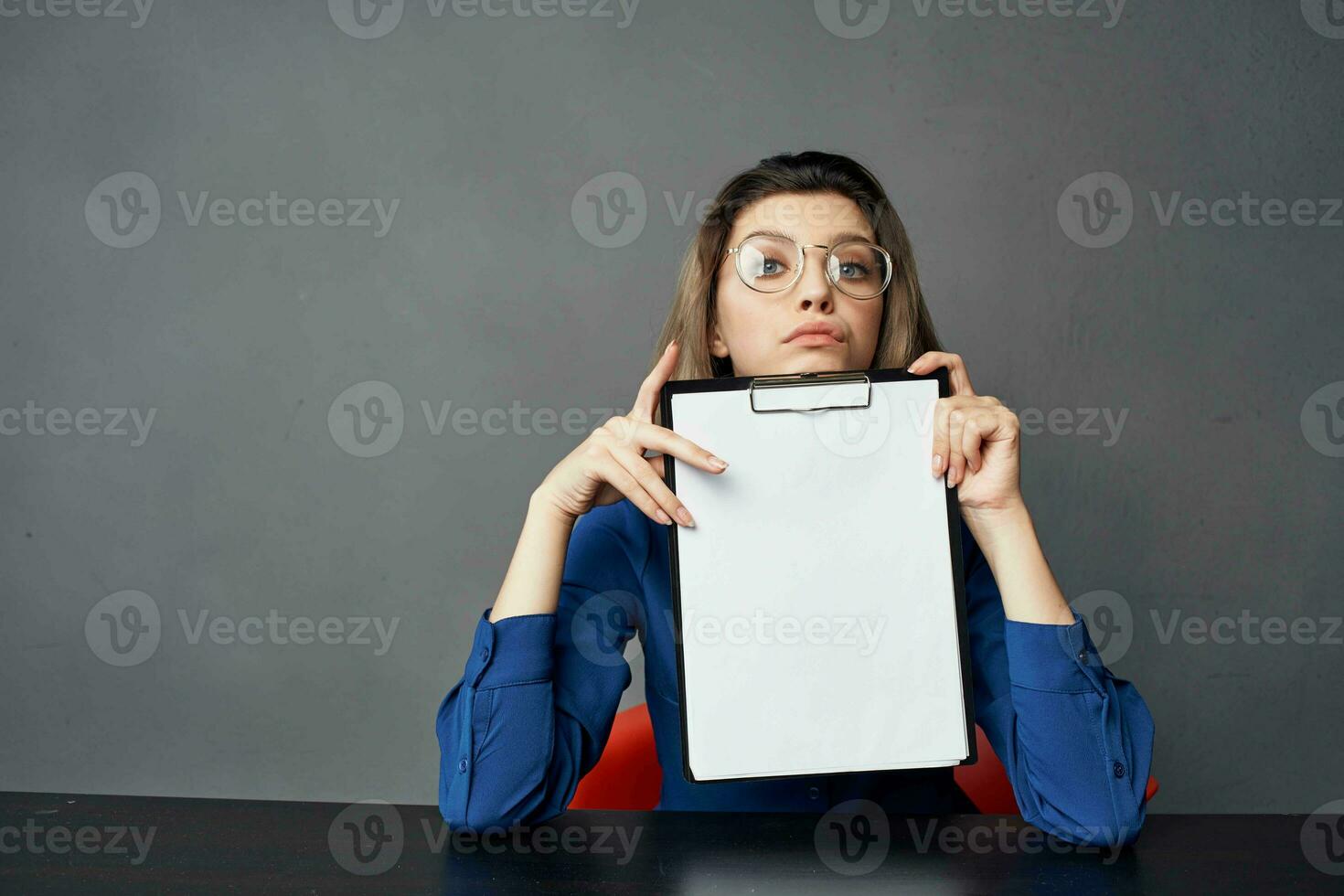 woman with glasses sitting at the table documents cropped view Copy Space photo