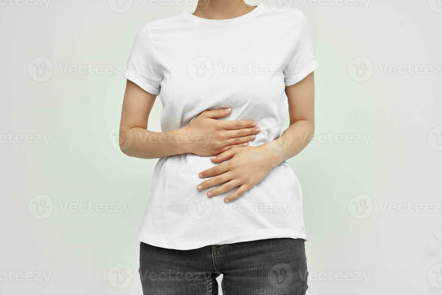 woman with abdominal pain diarrhea health problems light background 23415409 Stock Photo at Vecteezy