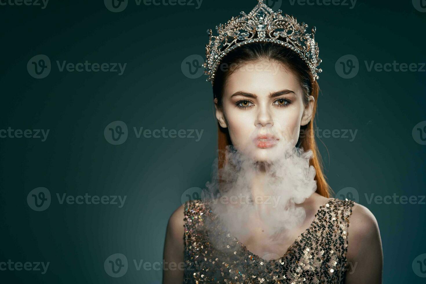 woman with a crown on her head smoke from the mouth Glamor luxury dark background photo