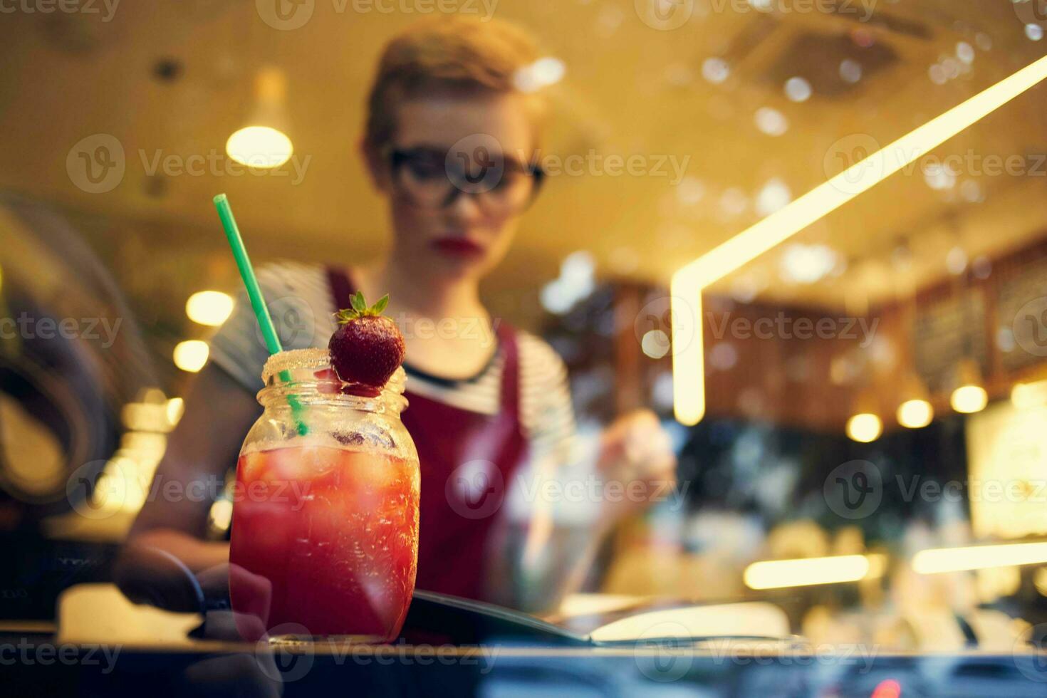woman sitting in a cafe cocktail looking out the window leisure lifestyle photo
