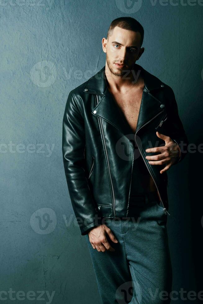 man in black leather jacket fashion modern style luxury dark background photo