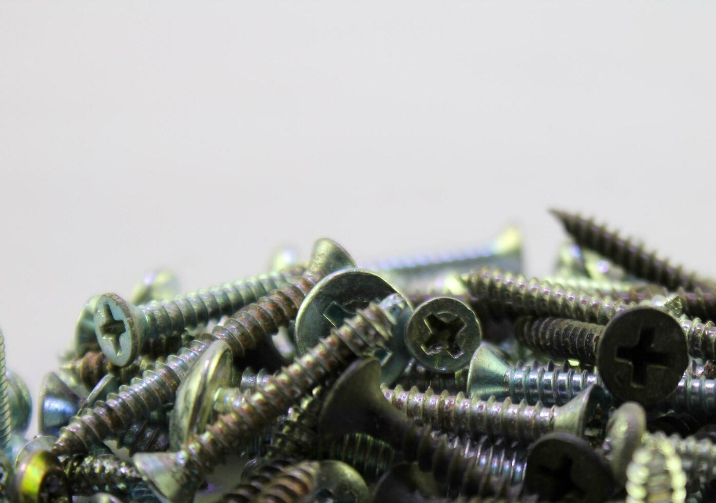 Selective Focus Macro photo of screws. Screws macro photo, screw on white background.