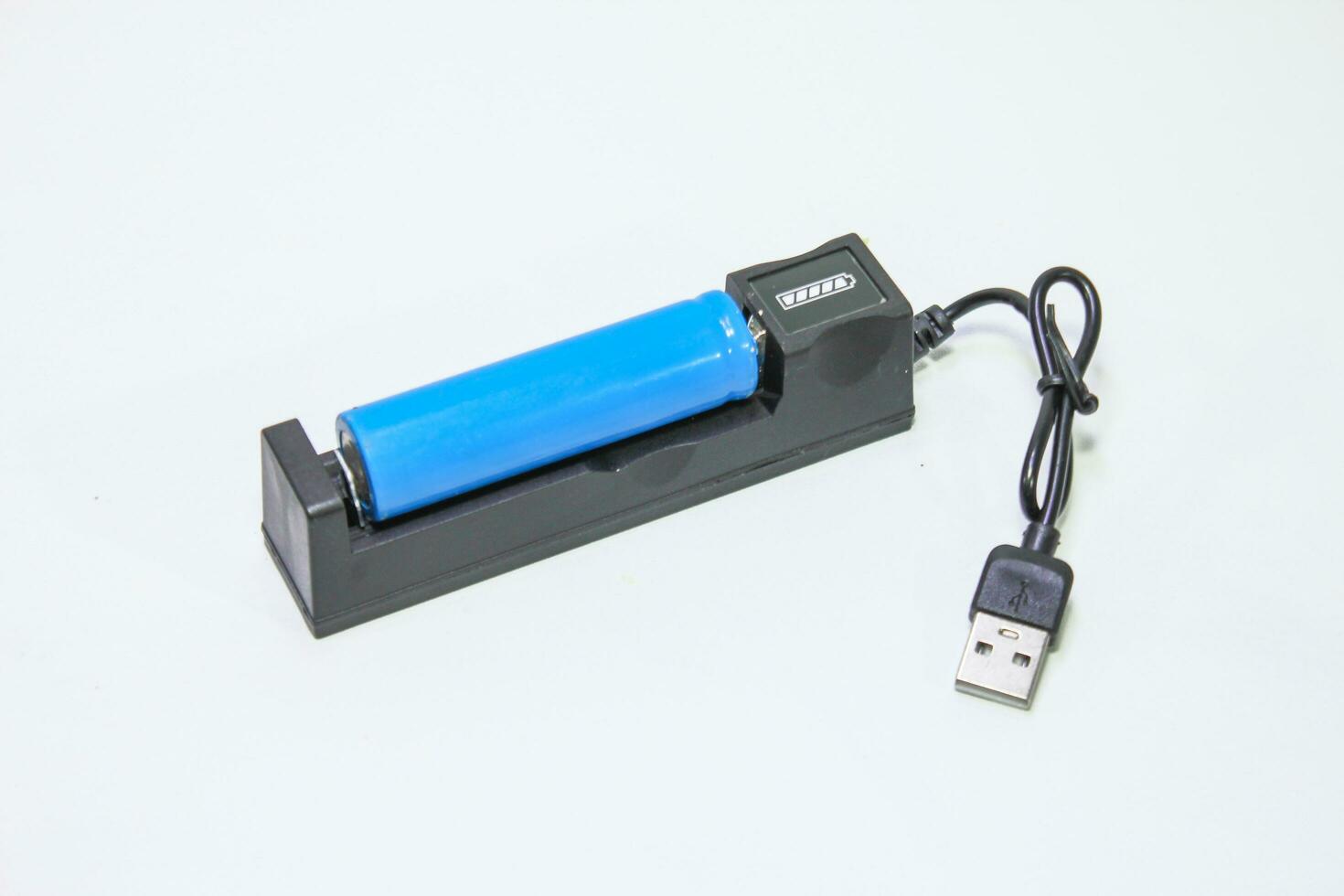 battery charger for 18650 battery on white background photo