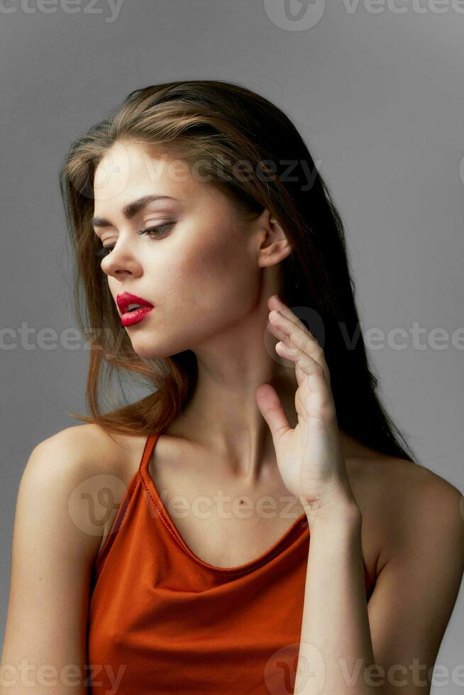 Beautiful glamor woman passion red dress cosmetics photo