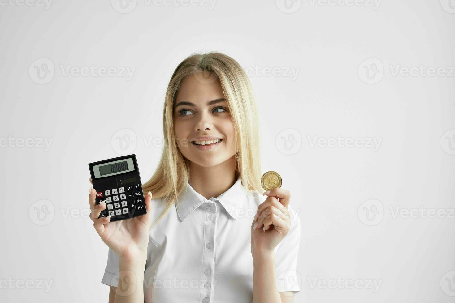 cheerful woman in a white shirt with a folder in hand light background photo