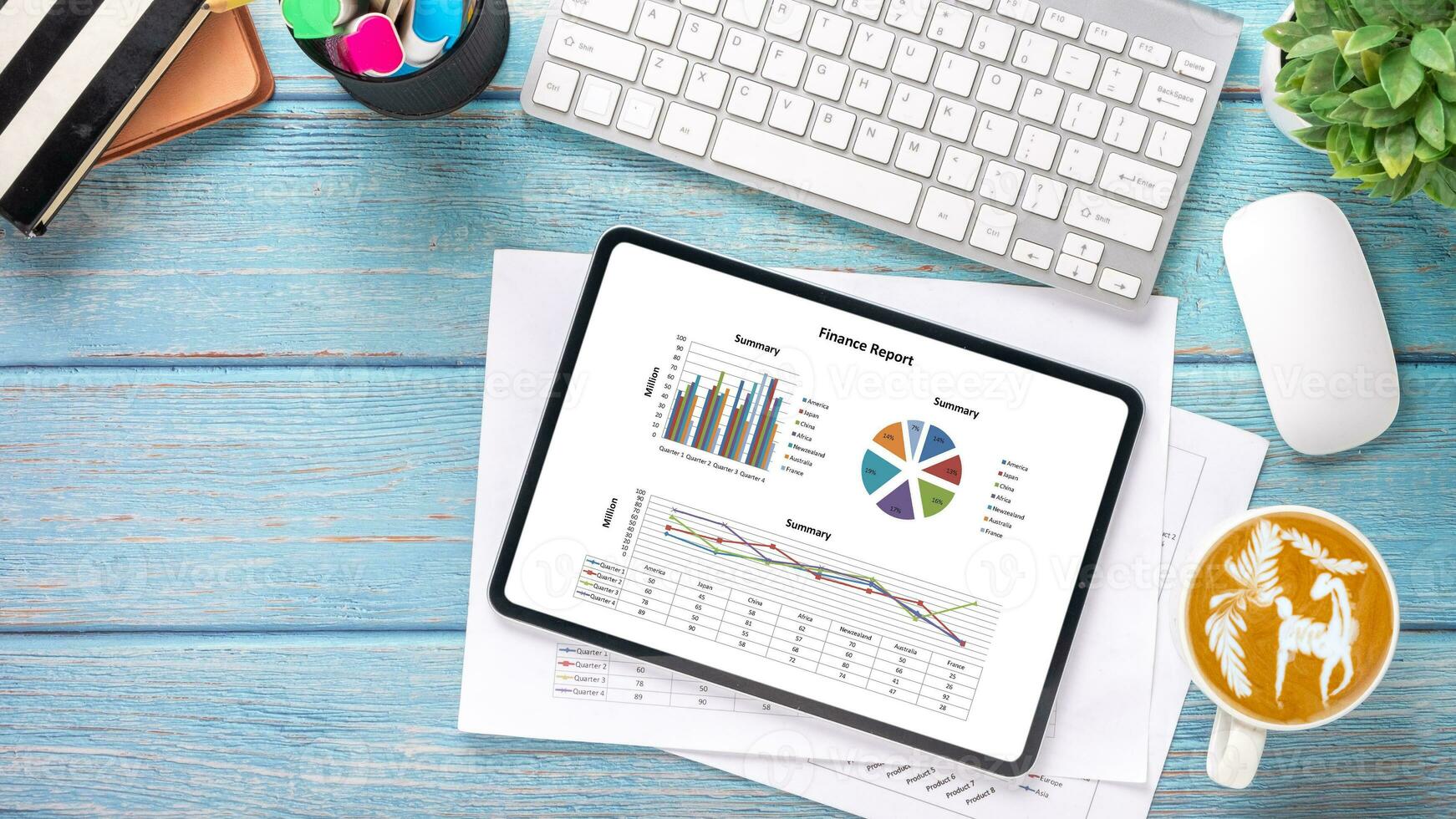 Tablet with charts and reports on office desk workplace. Top view flat lay. photo