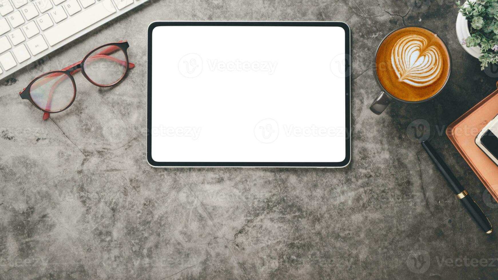 Dark office desk workplace with blank screen laptop computer, keyboard, eyeglass, notebook, pen and cup of coffee, TOp view flat lay with copy space. photo