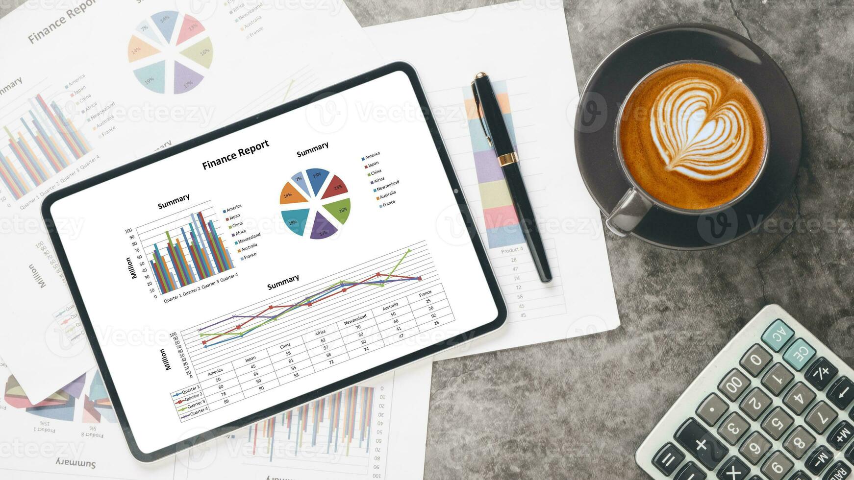 Tablet with charts and reports on office desk workplace. Top view flat lay photo