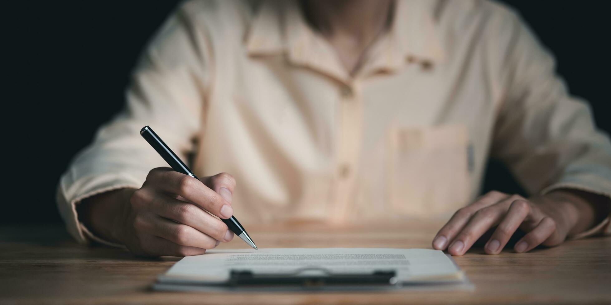 Businessman reviewing and managing documents and business agreements ,Signing a form ,signing a business contract approval ,contract documents confirmation or warranty certificate ,Business paperwork photo