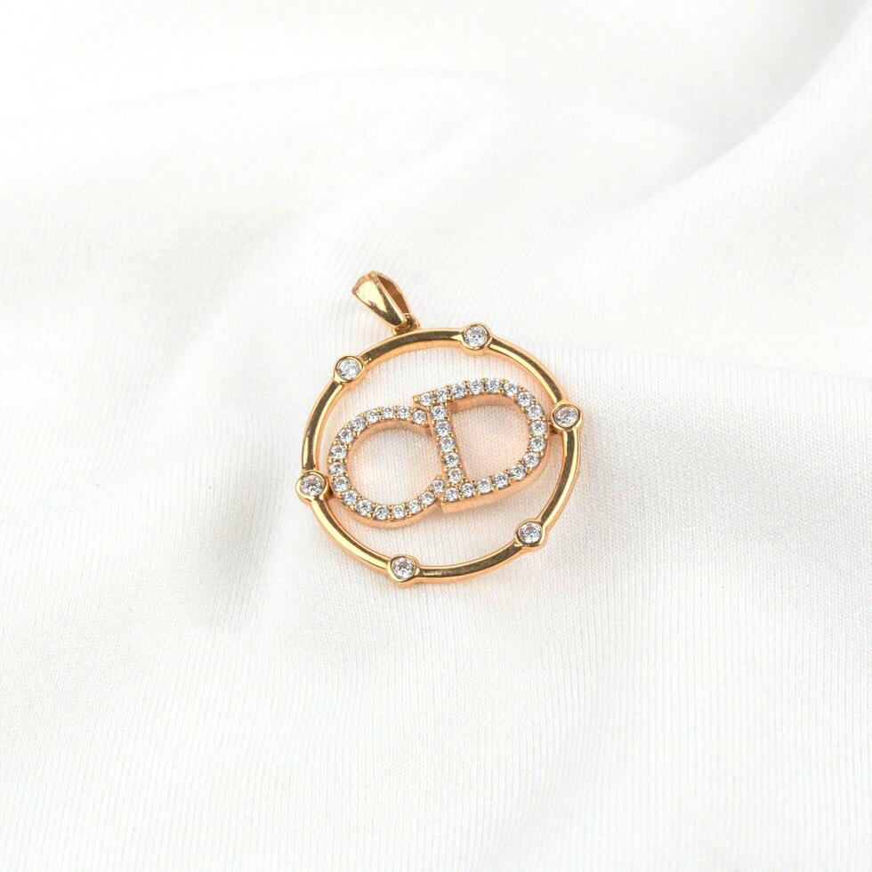 gold pendant with the character cd photo