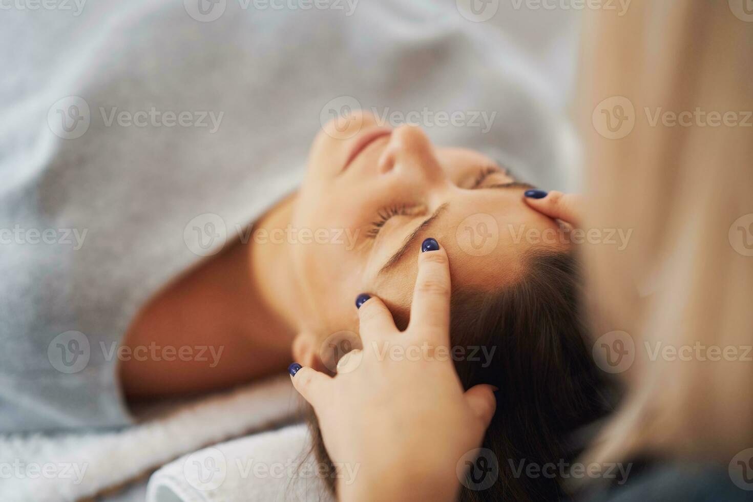 Picture of an treatment that involves gently touching 32 points on your head photo