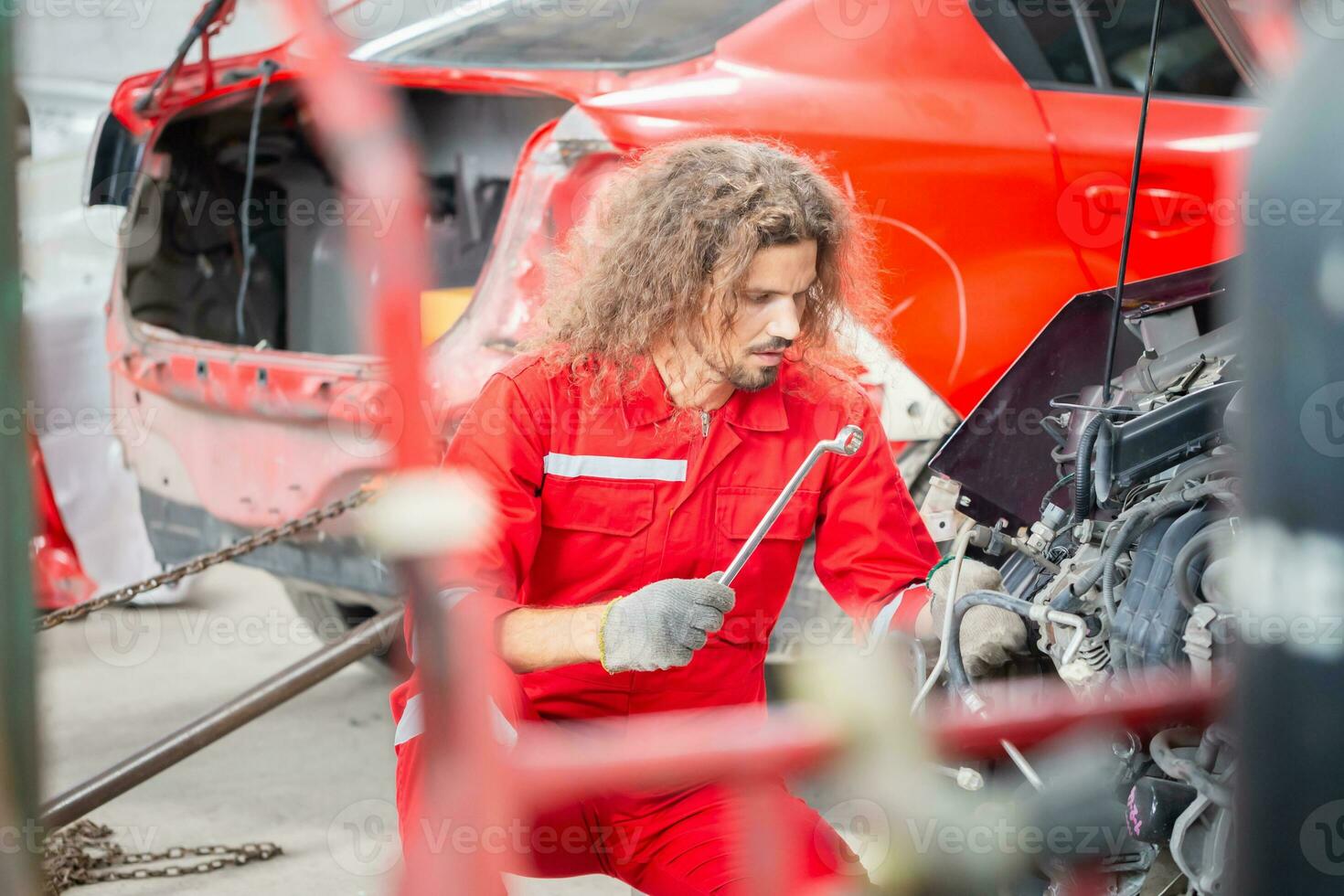 Technician man working in auto repair shop, Car mechanic in repair garage, Car repair and maintenance concepts photo