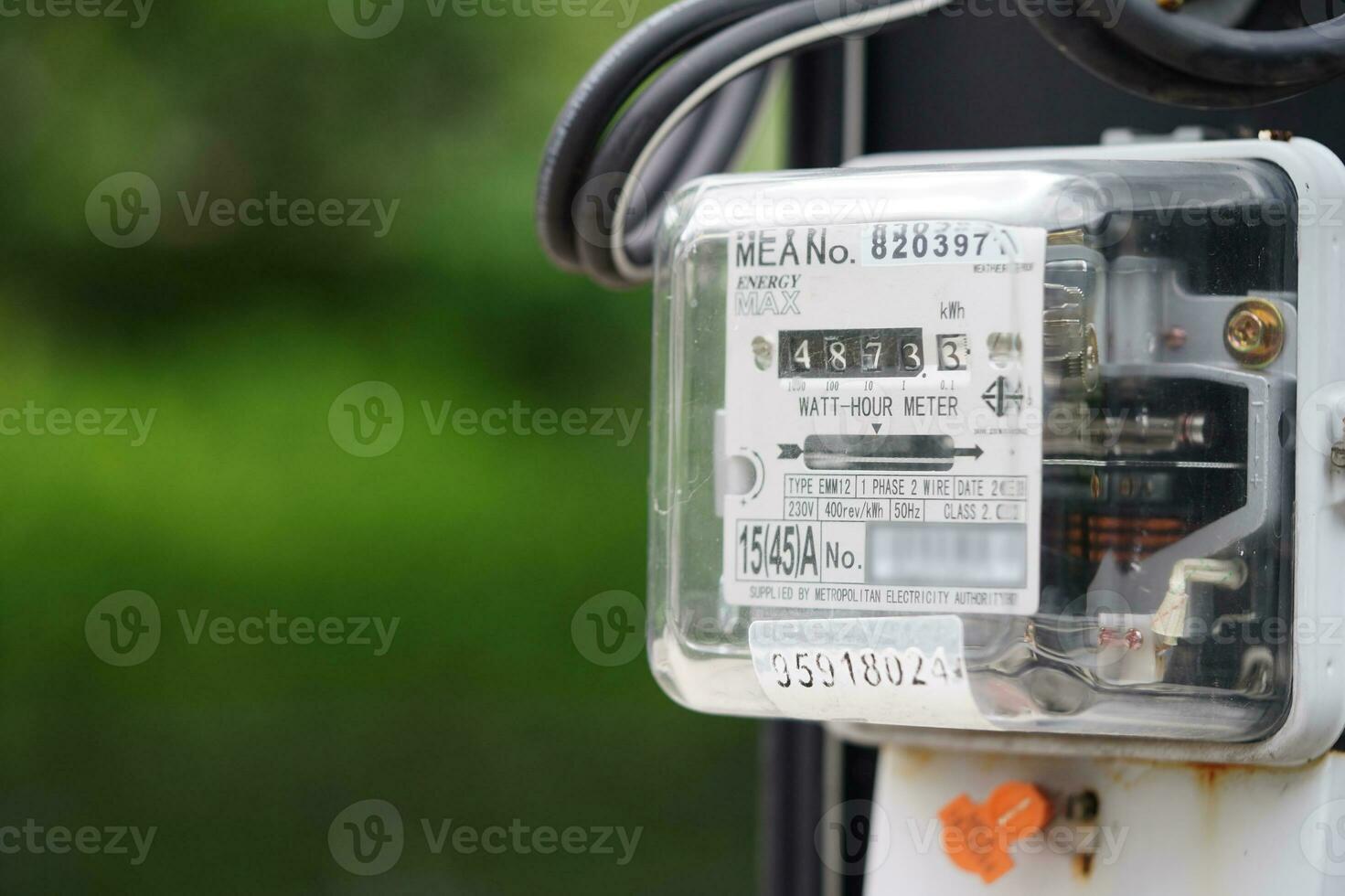 Electric measuring power meter for energy cost at home and office. photo