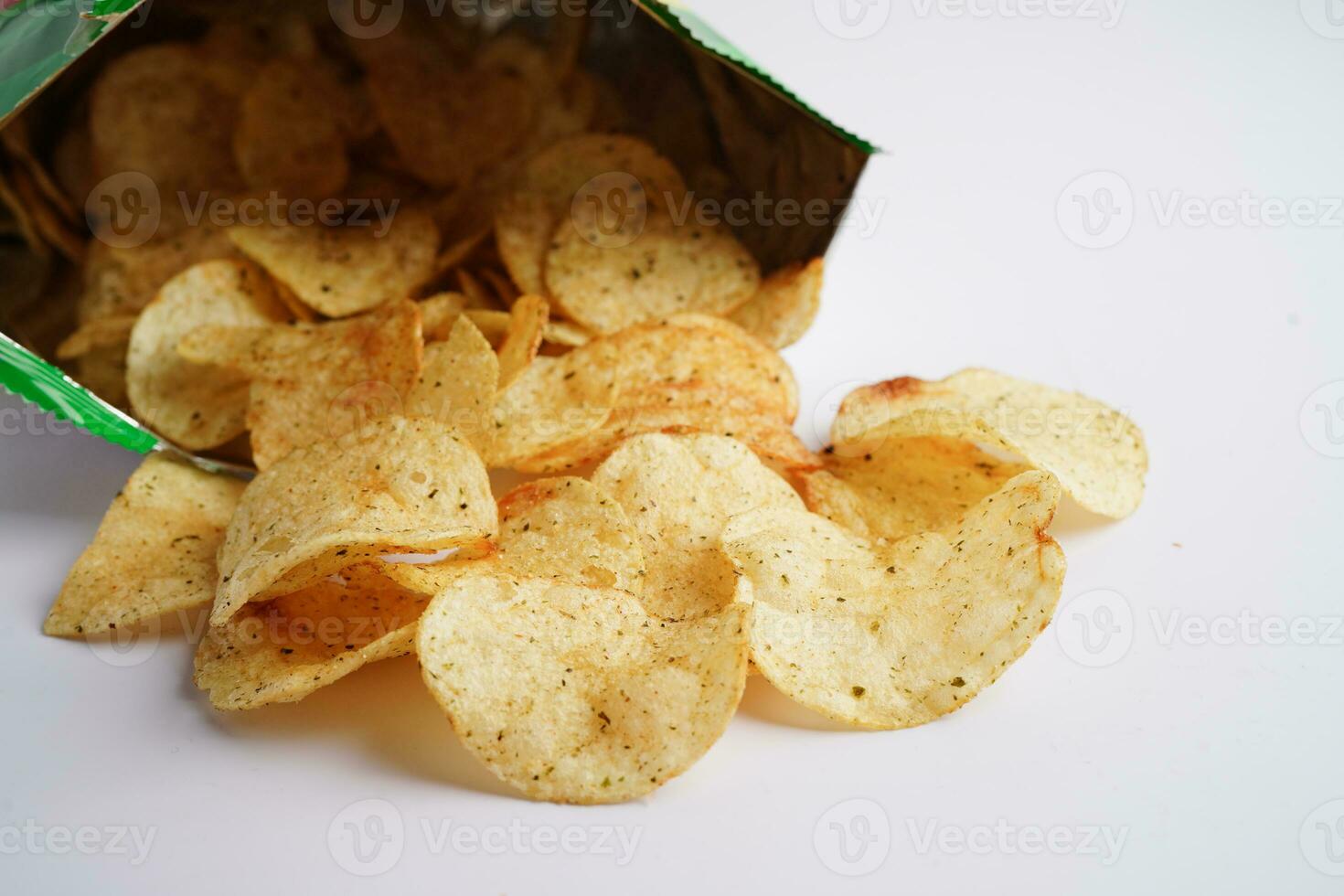 Potato chips in open bag, delicious BBQ seasoning spicy for crips, thin slice deep fried snack fast food in open bag. photo